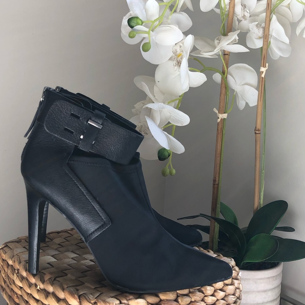 JD Joe’s black leather ankle booties stiletto heel pointed toe and buckle strap.